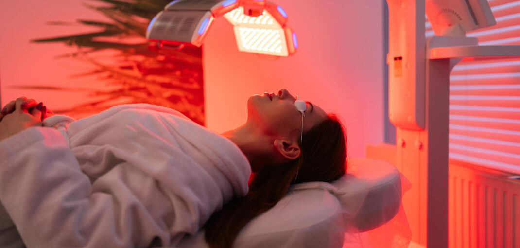 Woman experiencing the best red light therapy in Saraland AL for whole-body wellness