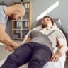 ale patient receiving IV hydration appointment at a wellness clinic while provider inserts IV line
